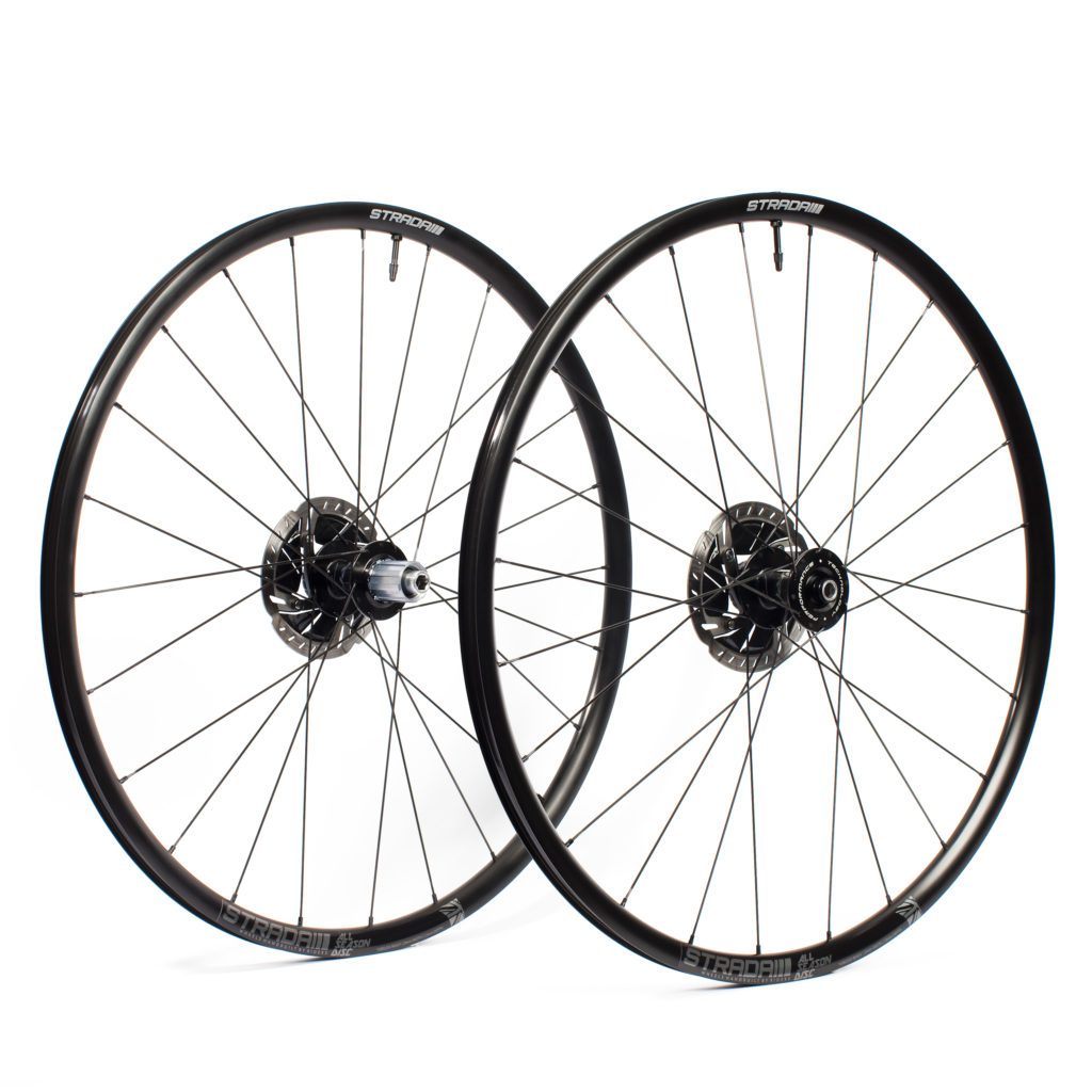 A picture showing a pair of Strada All Season Disc road bicycle wheels with black rims