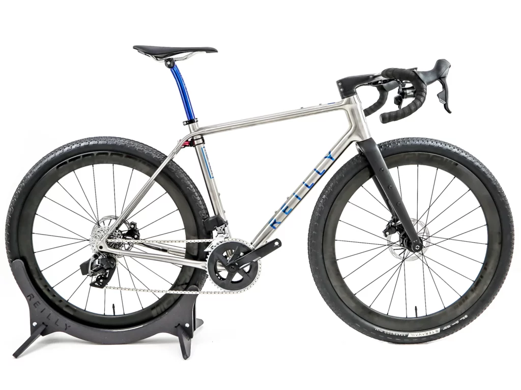 A Picture showing the Beautiful Reilly Reflex Titanium Gravel bike with the Strada Gravel Ultra Plus Wheelset