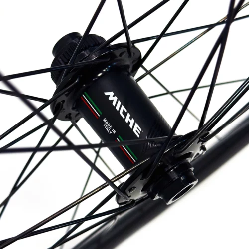 A picture showing a front Miche RDX Disc bicycle hub in black.