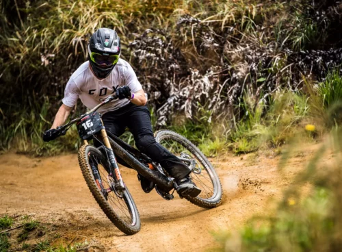 A picture showing an EWS racer cornering at speed on his endurance mountain bike with DT Swiss EX-511 wheels