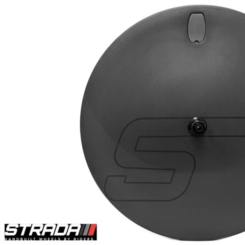 A picture showing a carbon Strada Ultra TT Disc disc Brake rear wheel in a raw carbon finish with a custom Strada S shape logo in Black