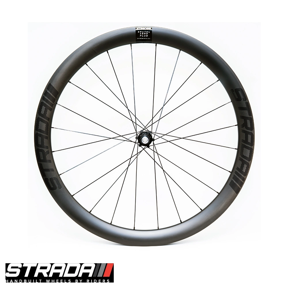 Front-facing profile of Strada Gravel Aero Plus carbon rear wheel showing deep-section rim, Strada branding and quick-releasing thru axle hub