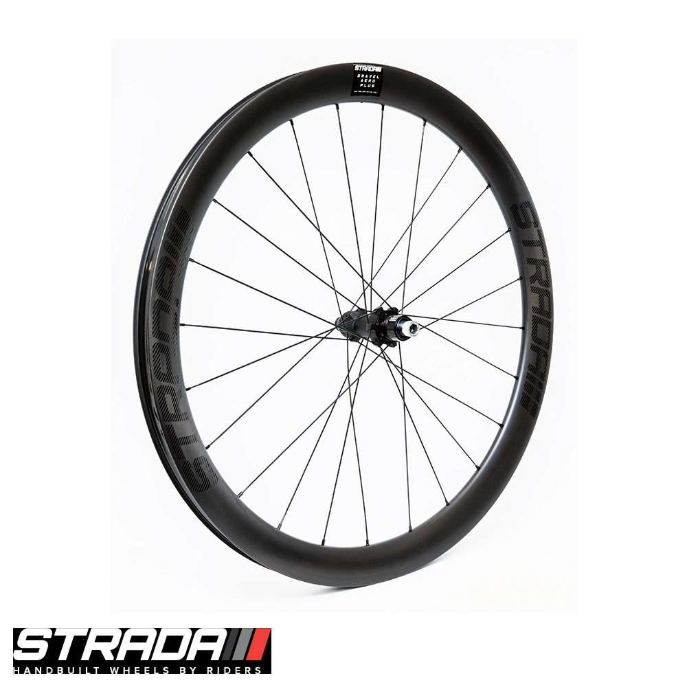 Full side view of Strada Gravel Aero Plus 2 black carbon rear wheel with freehub, black spokes and Strada branding on rim
