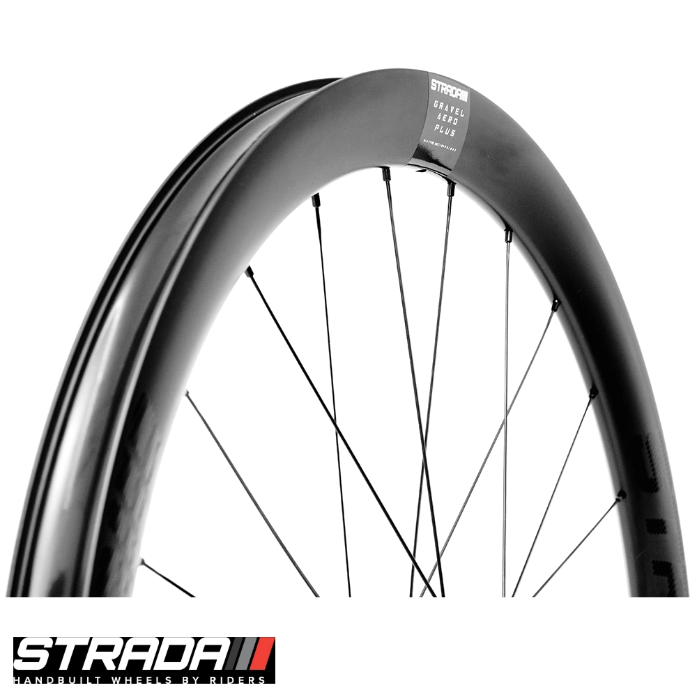 Side profile close-up of Strada Gravel Aero Plus deep-section carbon rim with Gravel Aero Plus label and black spokes
